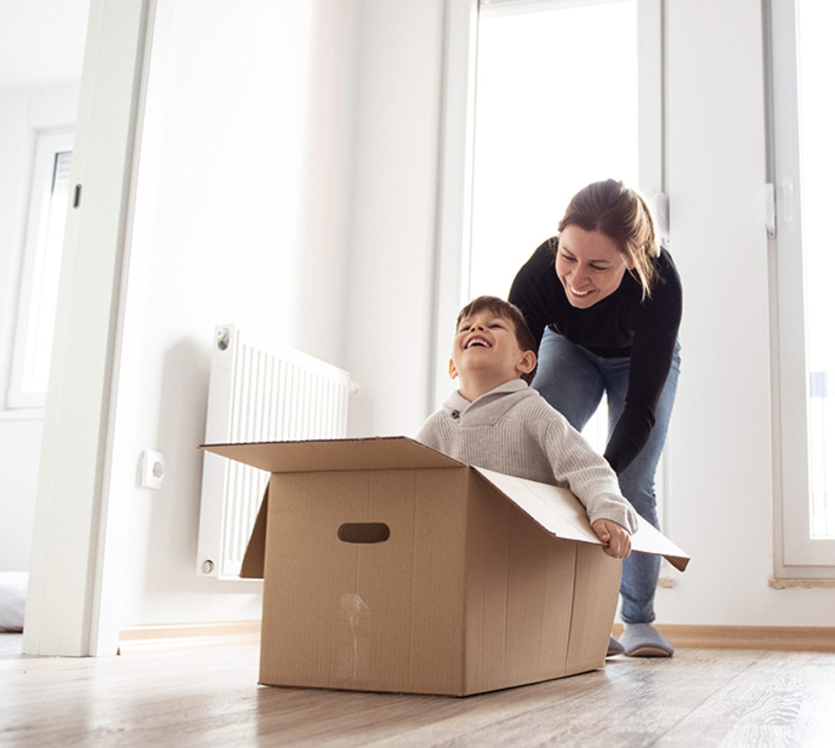 MOM AND CHILD IN MOVING BOX